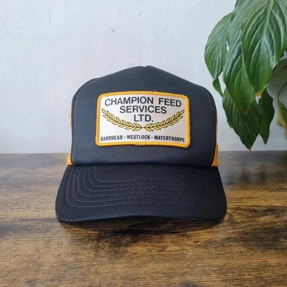 Vintage American Trucker Hat Snapback cap one size adjustable black yellow champion feed services